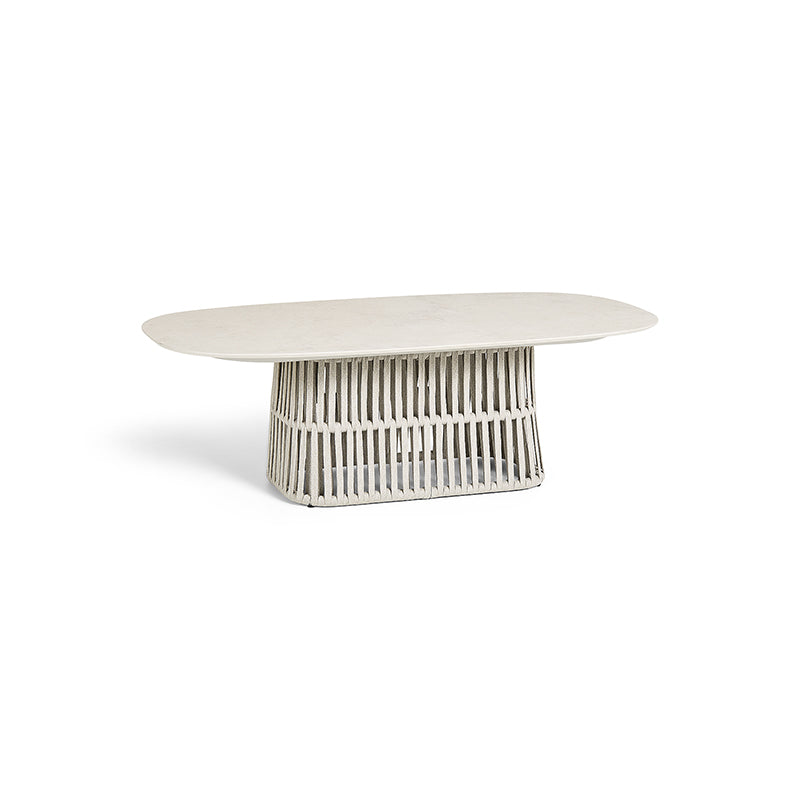 Oval-shaped white marble dining table with a metallic wire frame base, showcasing a sleek and modern design.