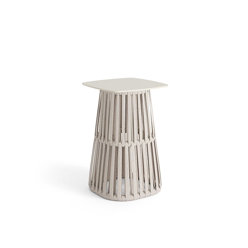 A modern, minimalist side table with a slender, ribbed concrete base and a square, off-white tabletop.